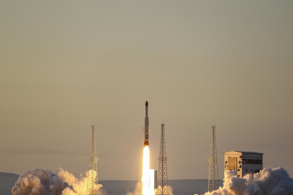 This photo released by the official website of the Iranian Defense Ministry on Thursday, Dec. 30, 2021, shows the launching of Simorgh, or "Phoenix," rocket in an undisclosed location in Iran. Iran on Thursday announced it launched a satellite carrier rocket bearing three devices into space, though it's unclear whether any of the objects entered orbit around the Earth. (Iranian Defense Ministry via AP)
